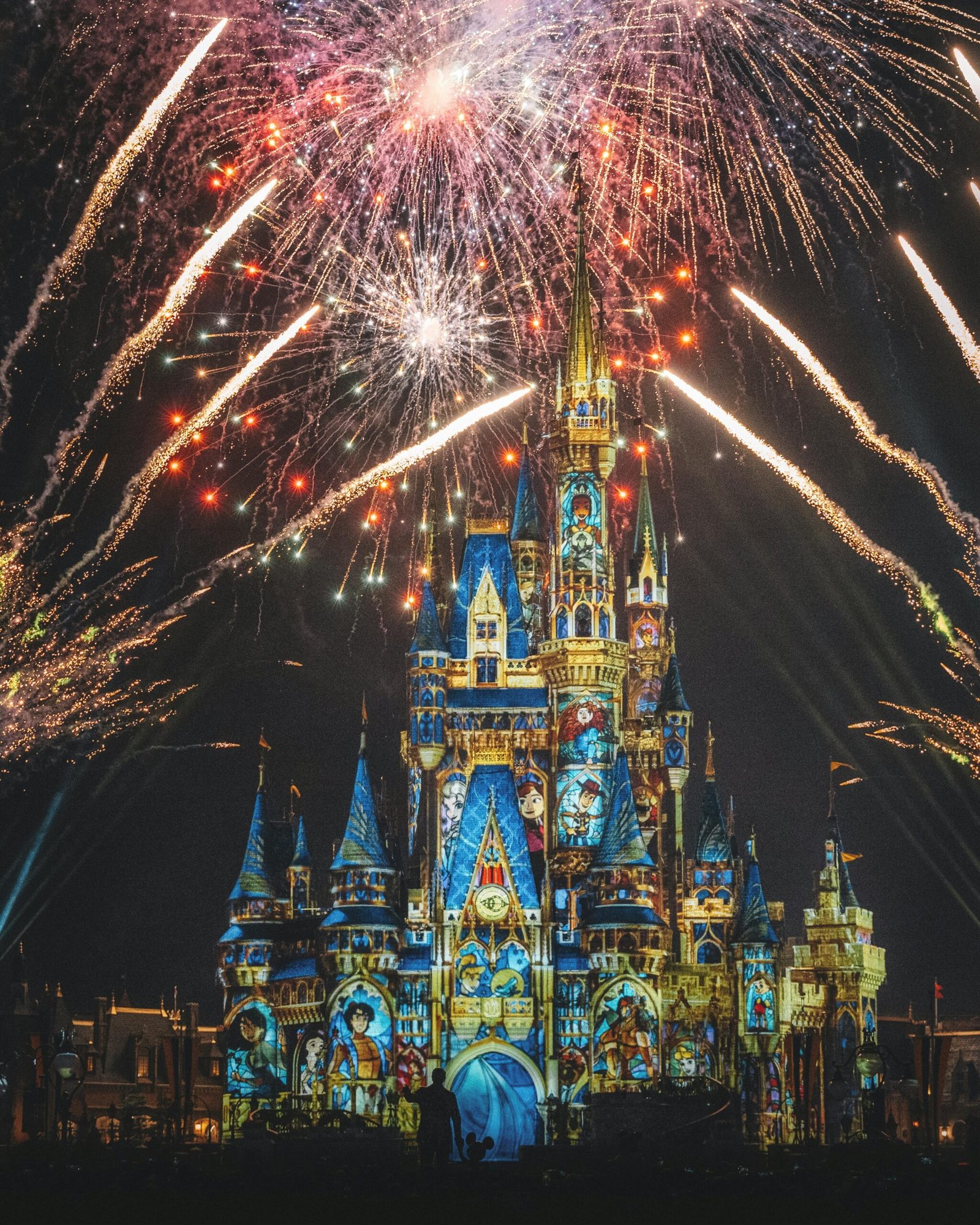 Dazzling fireworks illuminate the night sky above the enchanting Disney Castle.